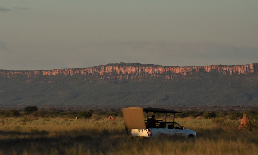 Habitat Loss - Responsible Tourism CCF's truck in front of the Waterberg Plateau